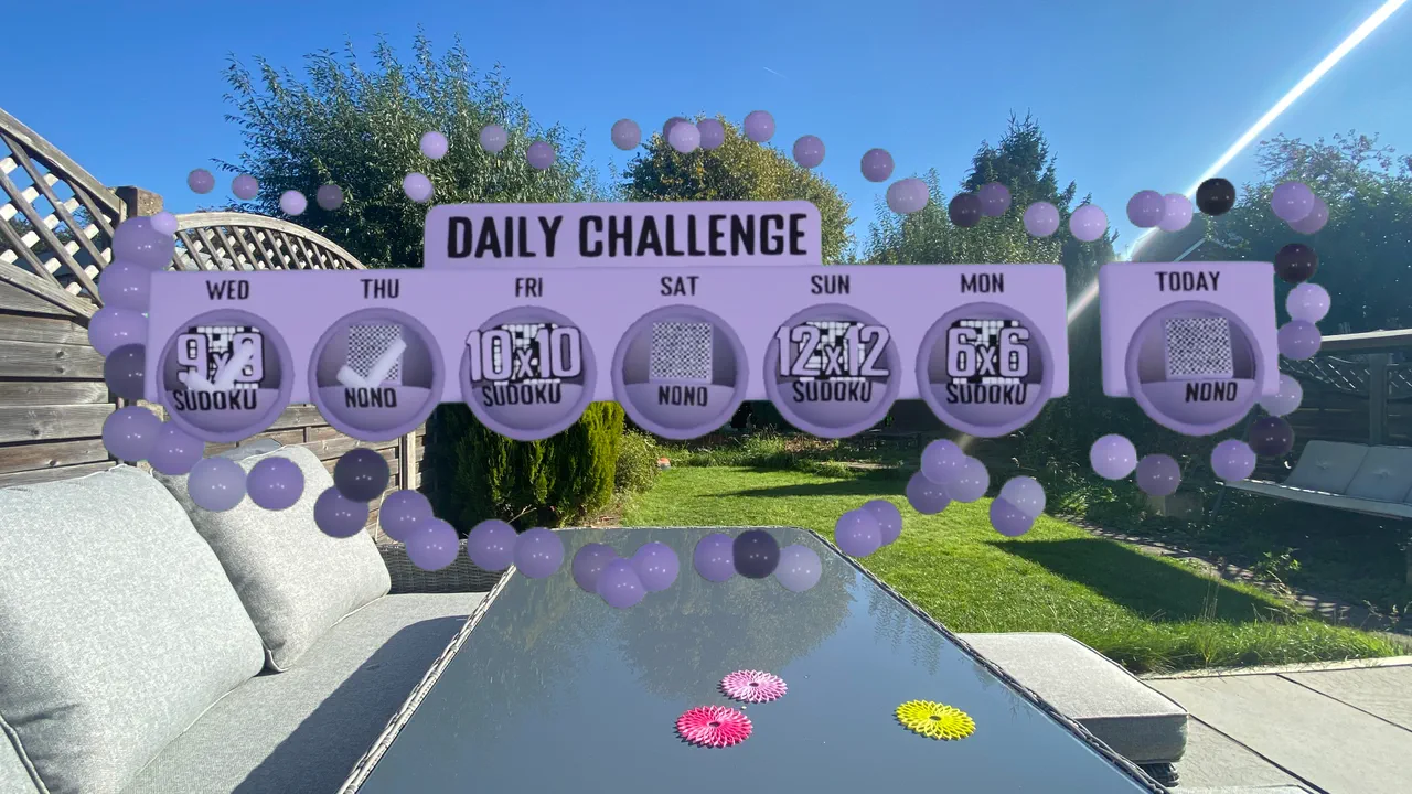 The Daily Challenge week strip, rotating Sudoku and Nonogram puzzles across sizes from 6x6 to 12x12.