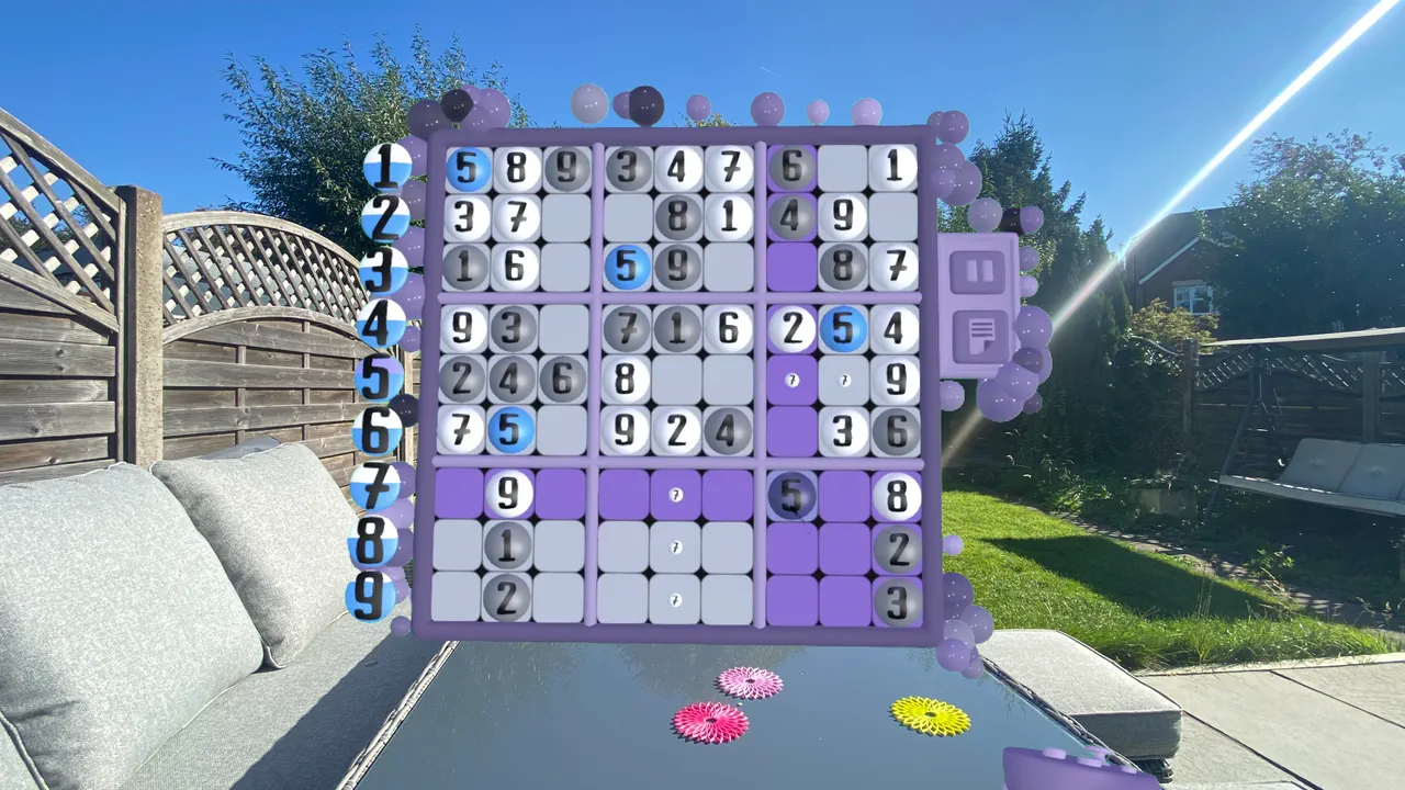 A 9x9 Sudoku board floating above a garden table, with the number tally column showing how many of each digit are left to place.